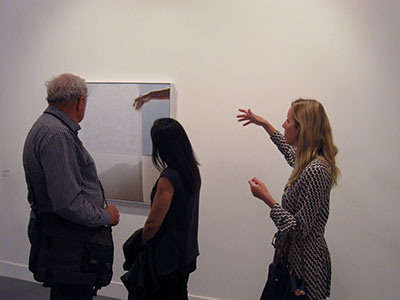 Our VIP Tour Guide, Noelle, discussing an Uta Barth photo with members of INFOCUS.
